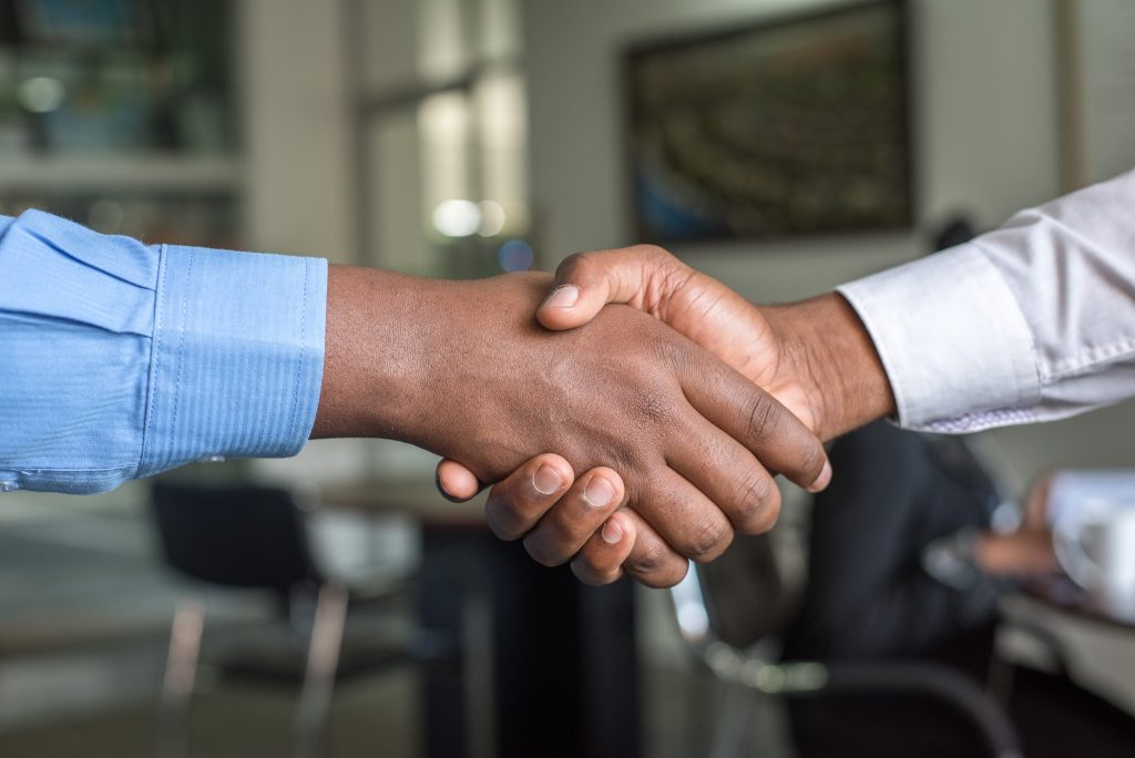 Two Insurance Brokers shaking hands