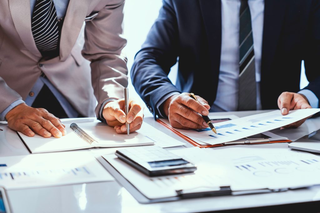 Two Insurance Brokers working through paperwork