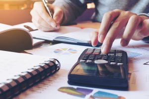 Man working with a calculator